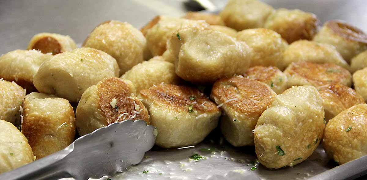 a photo of garlic knots in a pan
